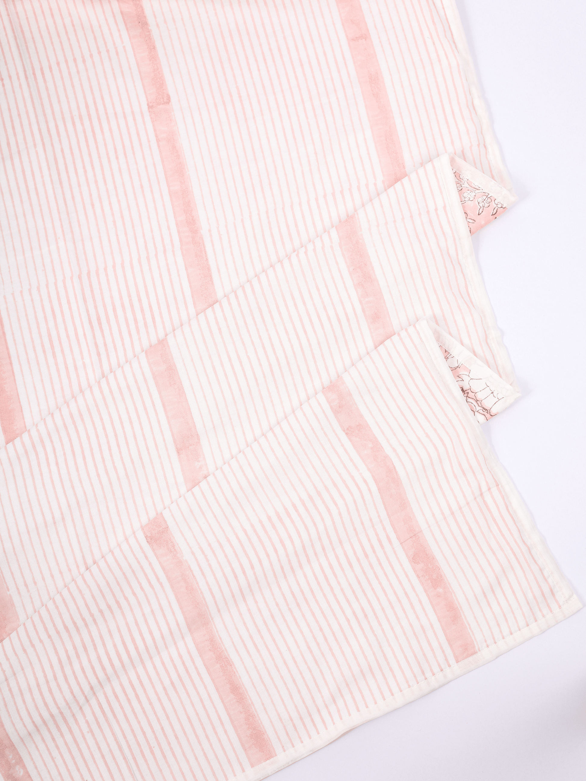 Peach floral AC dohar with striped reverse