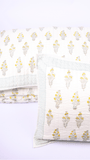 Double bed cover with matching pillow covers in green and yellow
