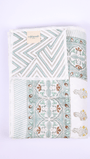 Double bed dohar with green chevrons and floral reverse