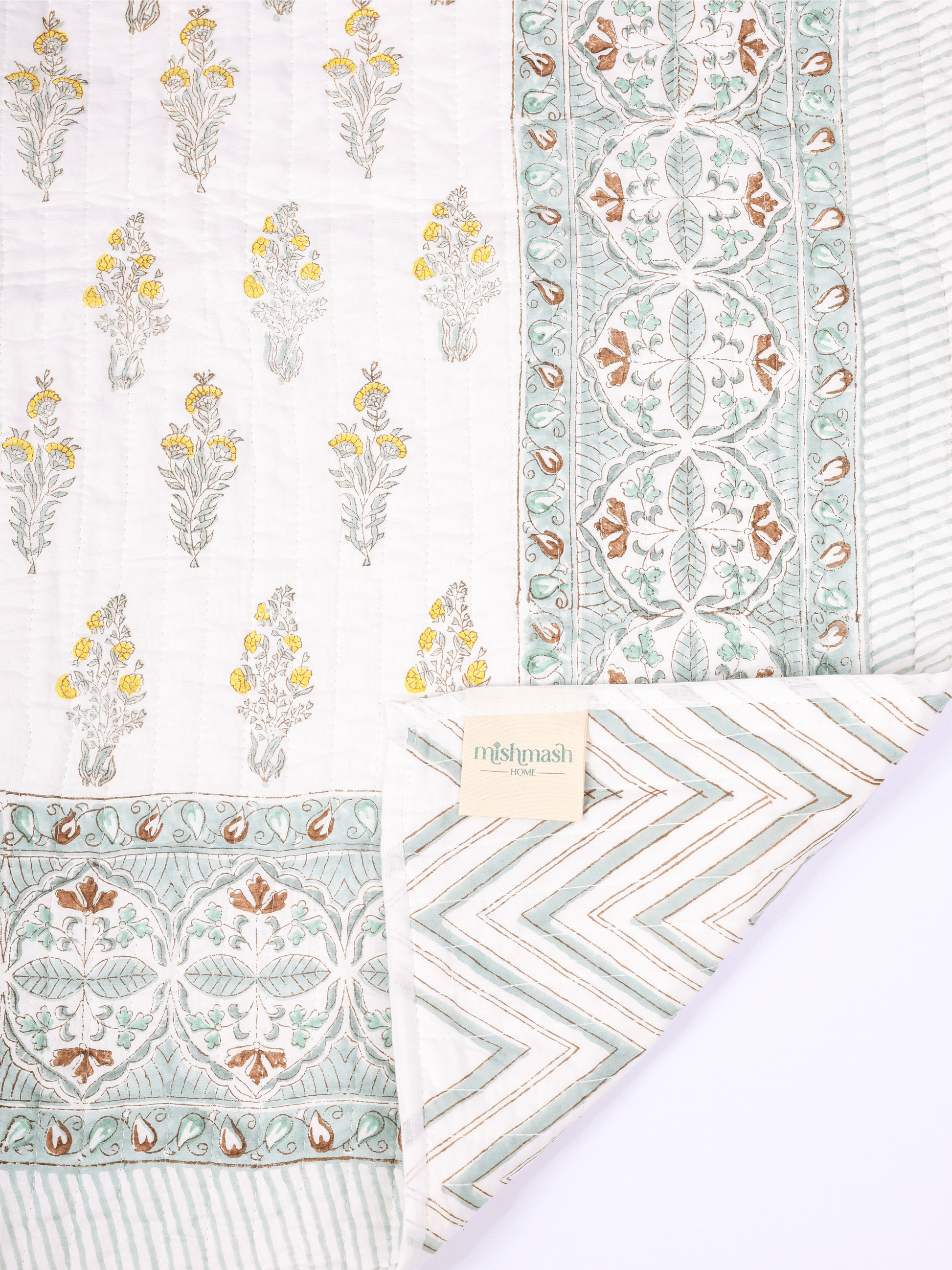 Floral double bed cover with green geometric reverse