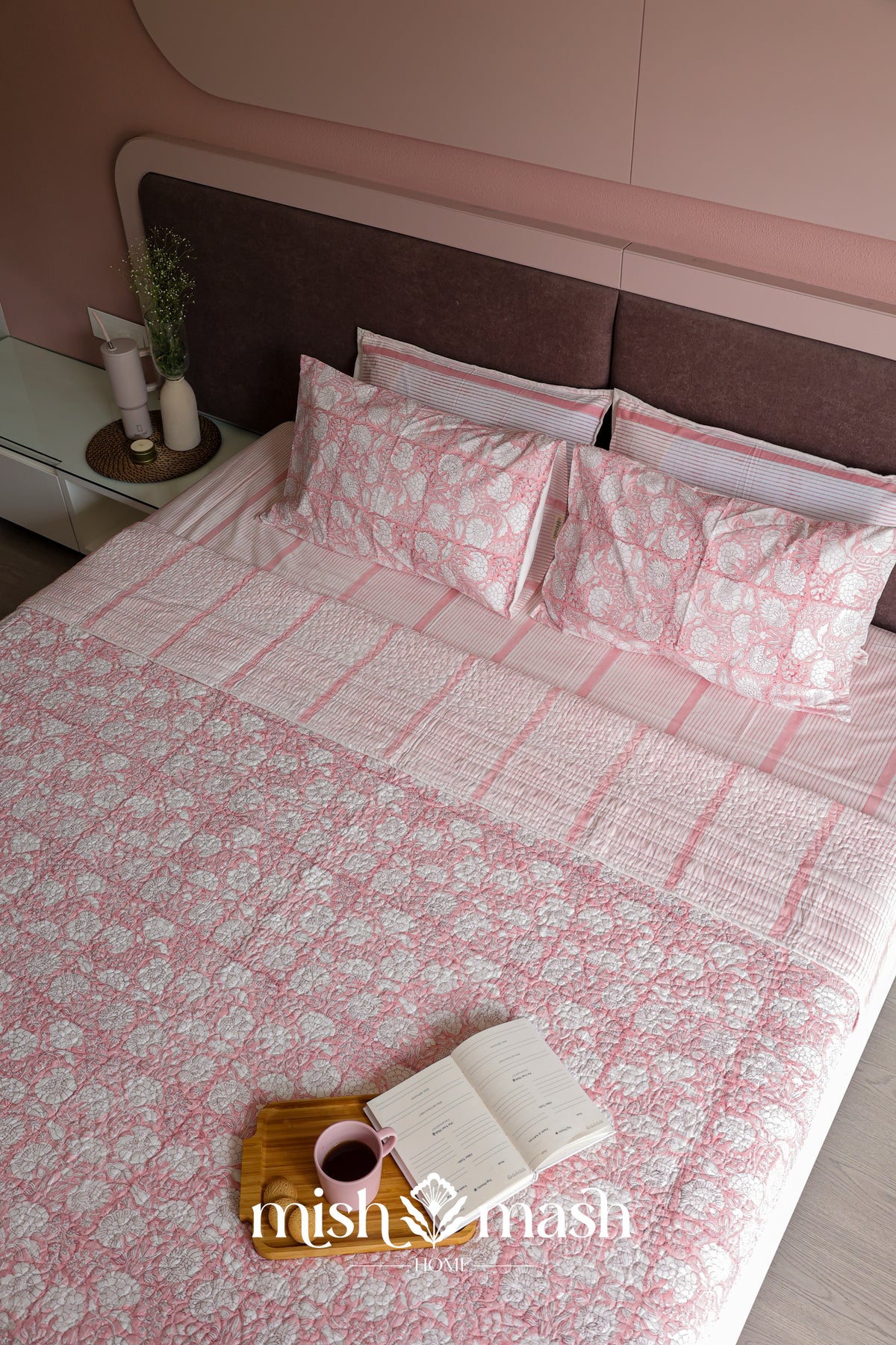Peach striped double bed bedsheet styled in a bedroom