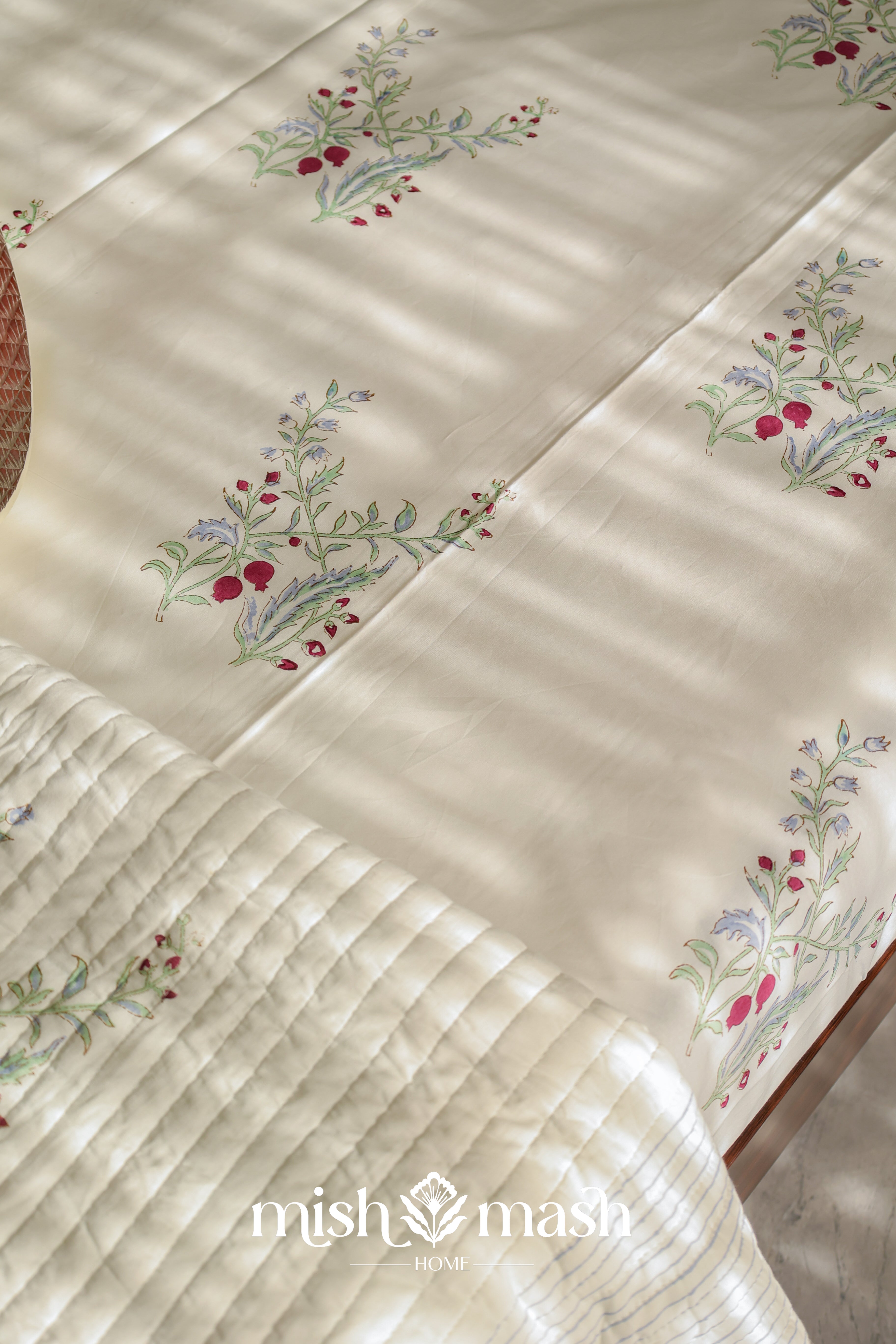 anaar print pure cotton bedsheet on a bed