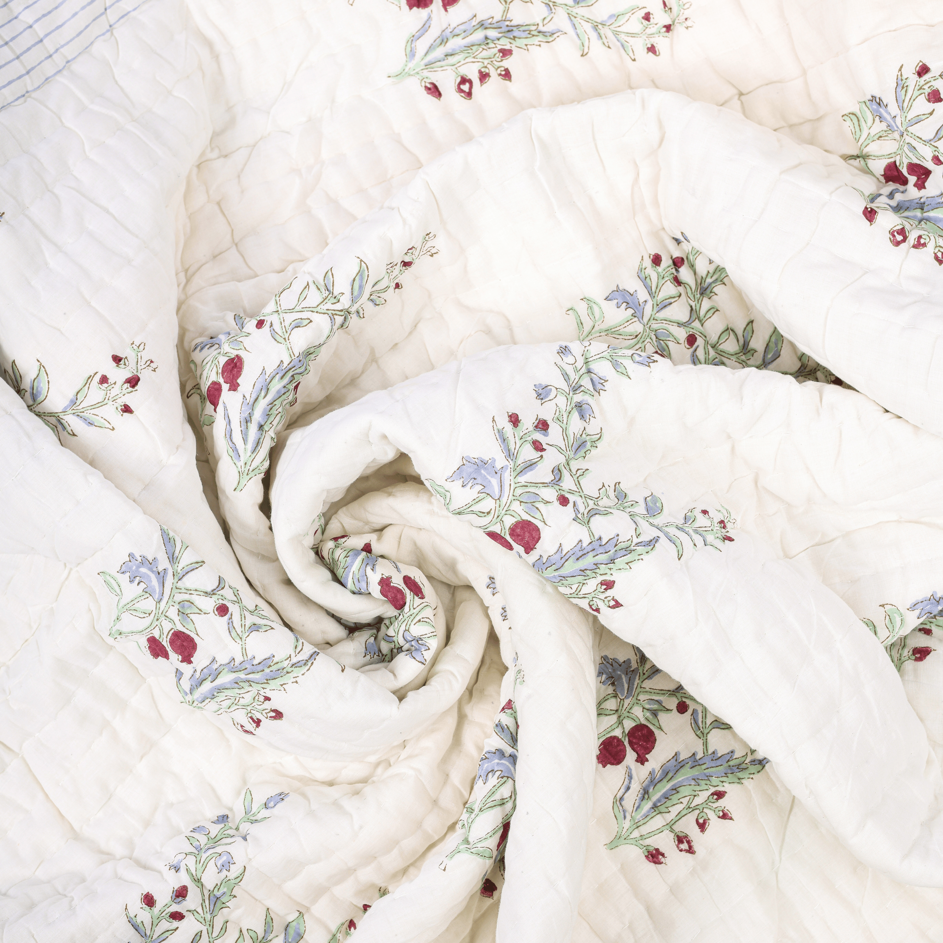 Mulmul cotton quilt with hand block printed anar design