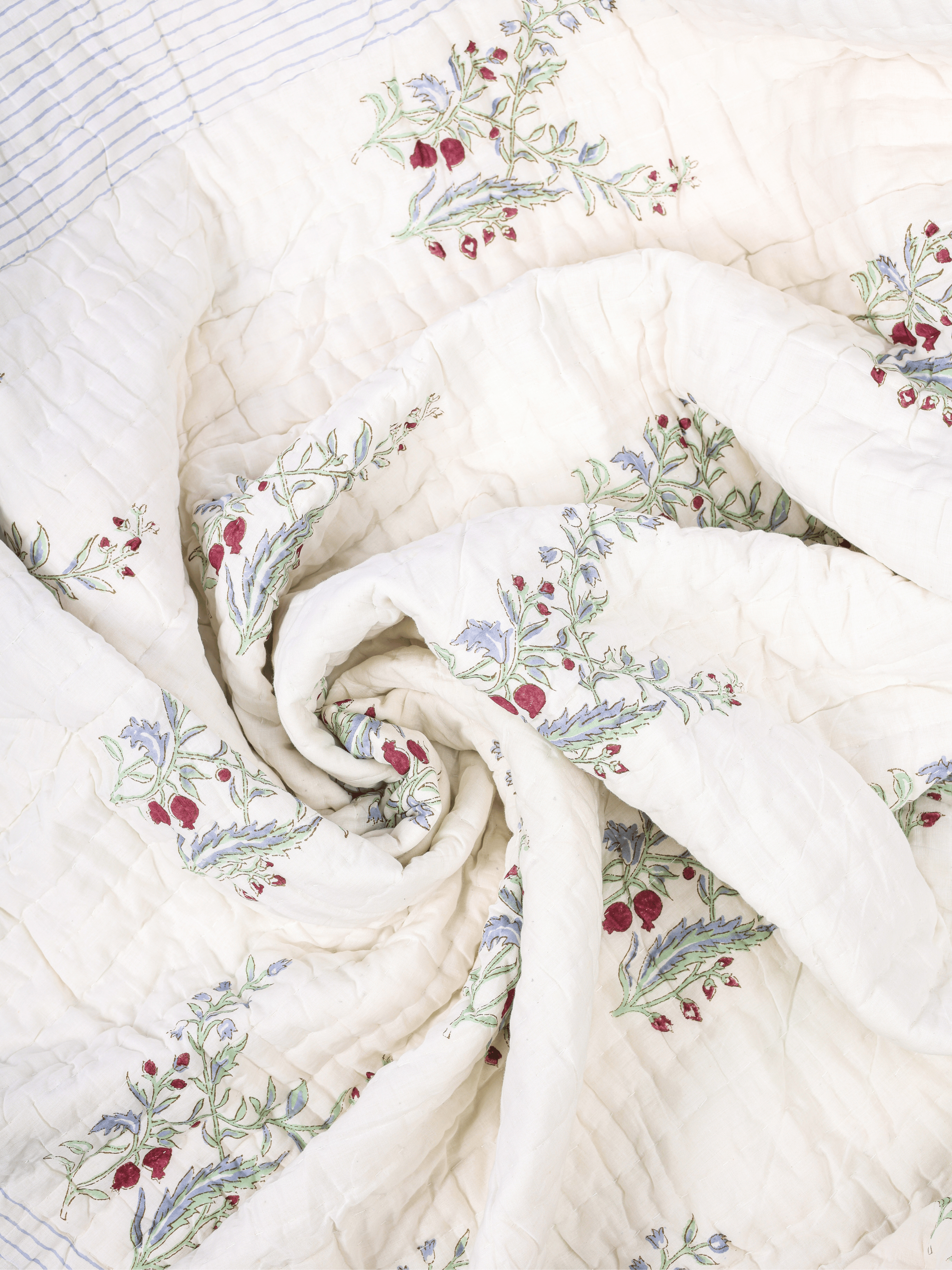 Mulmul cotton quilt with hand block printed anar design