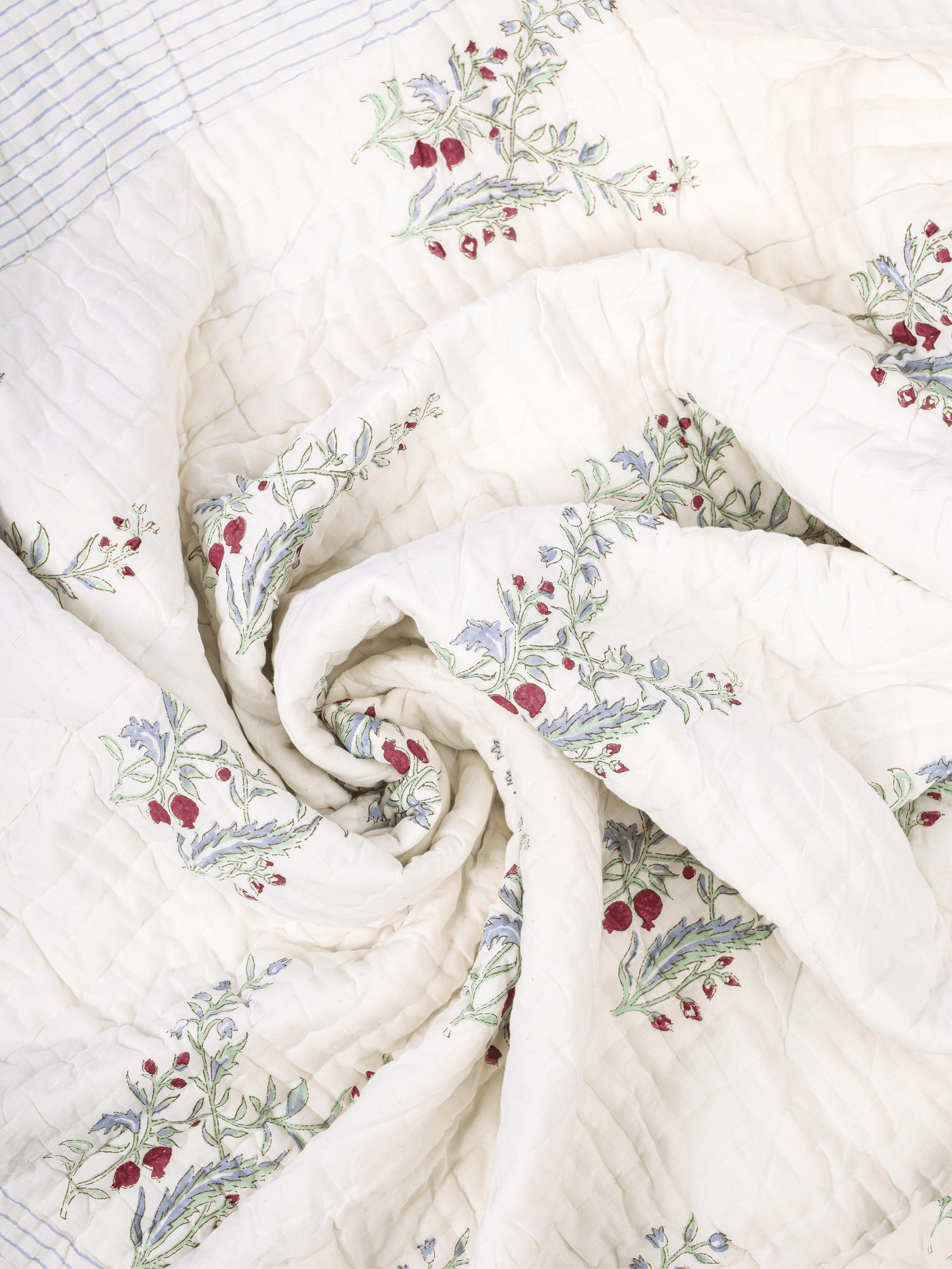 Mulmul cotton quilt with hand block printed anar design