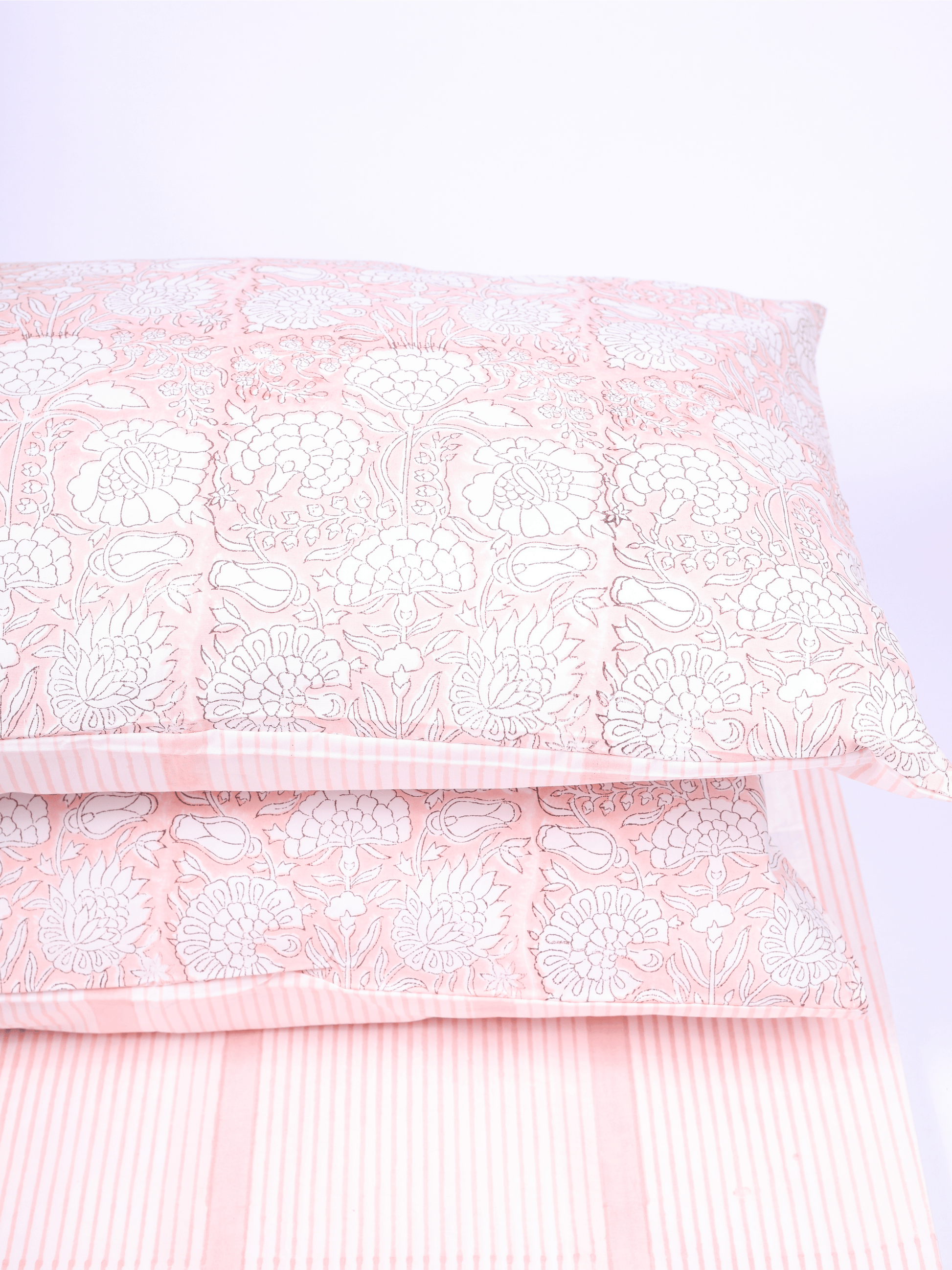 Peach striped double bed bedsheet with reversible pillow covers