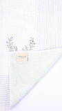 Anar motif bed cover with reversible striped design