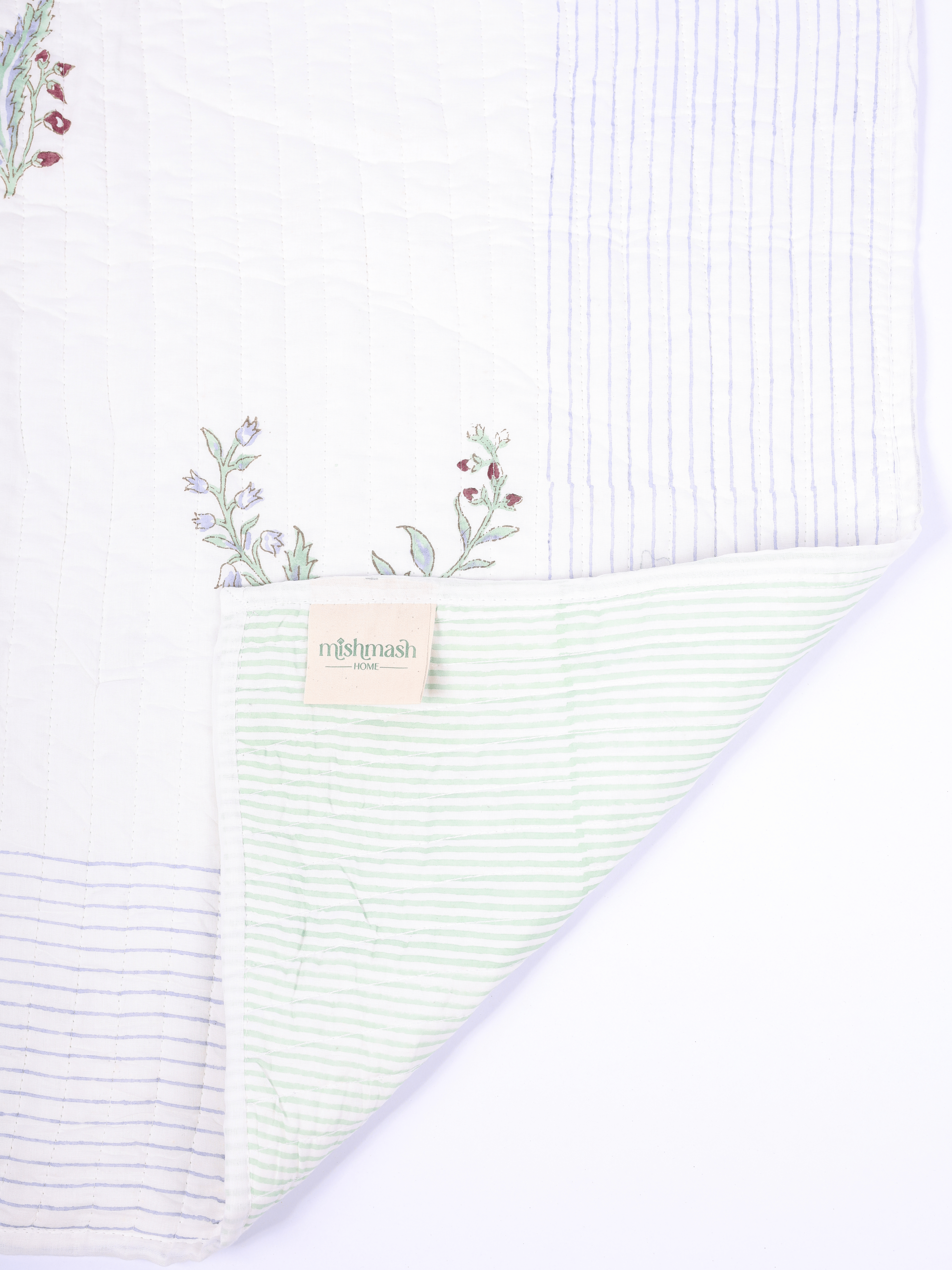 Anar motif bed cover with reversible striped design