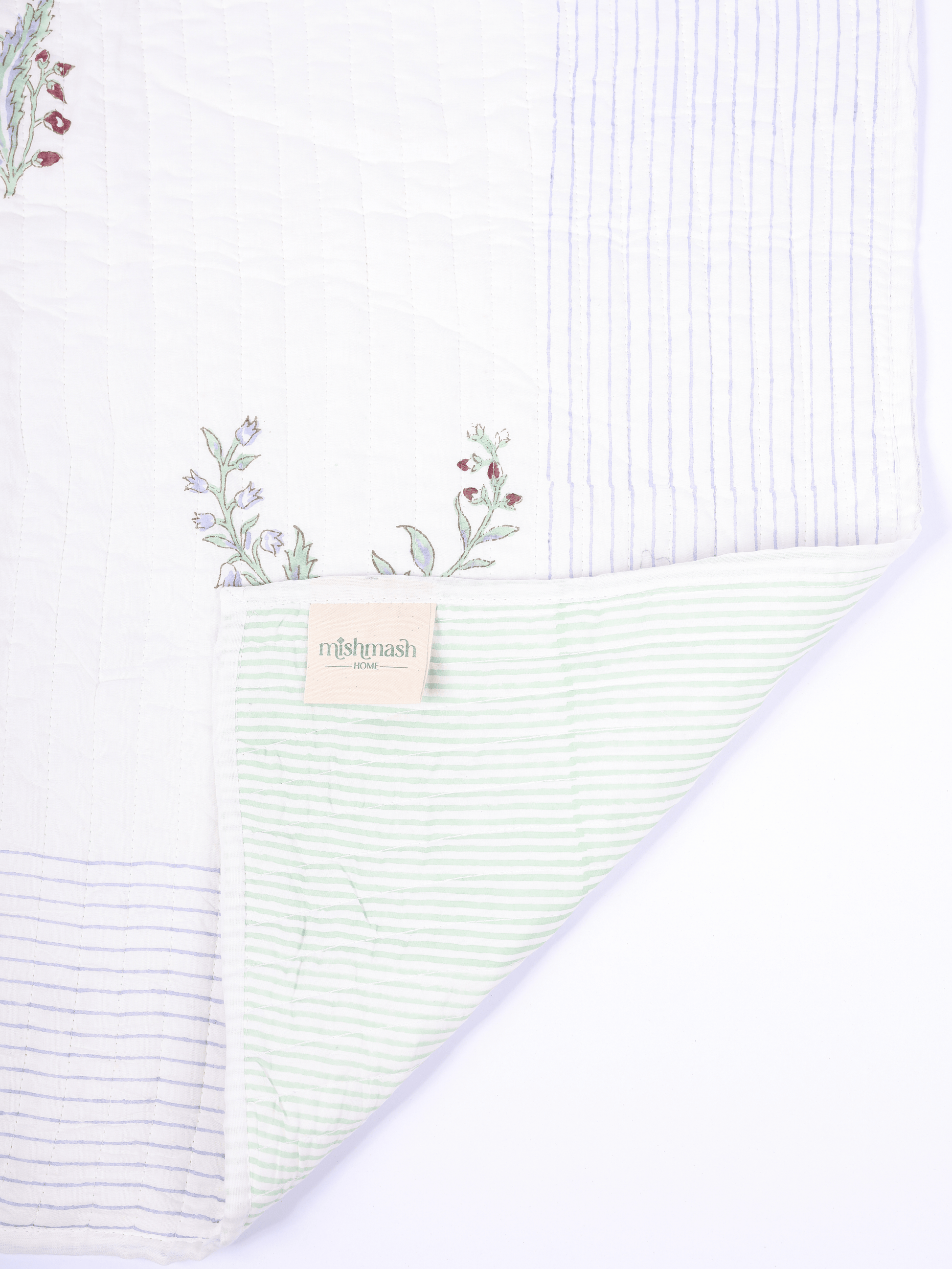 Anar motif bed cover with reversible striped design