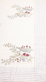 Hand block printed cotton quilt with green anar motifs